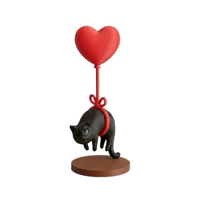 Figurine chat flottant avec ballon coeur